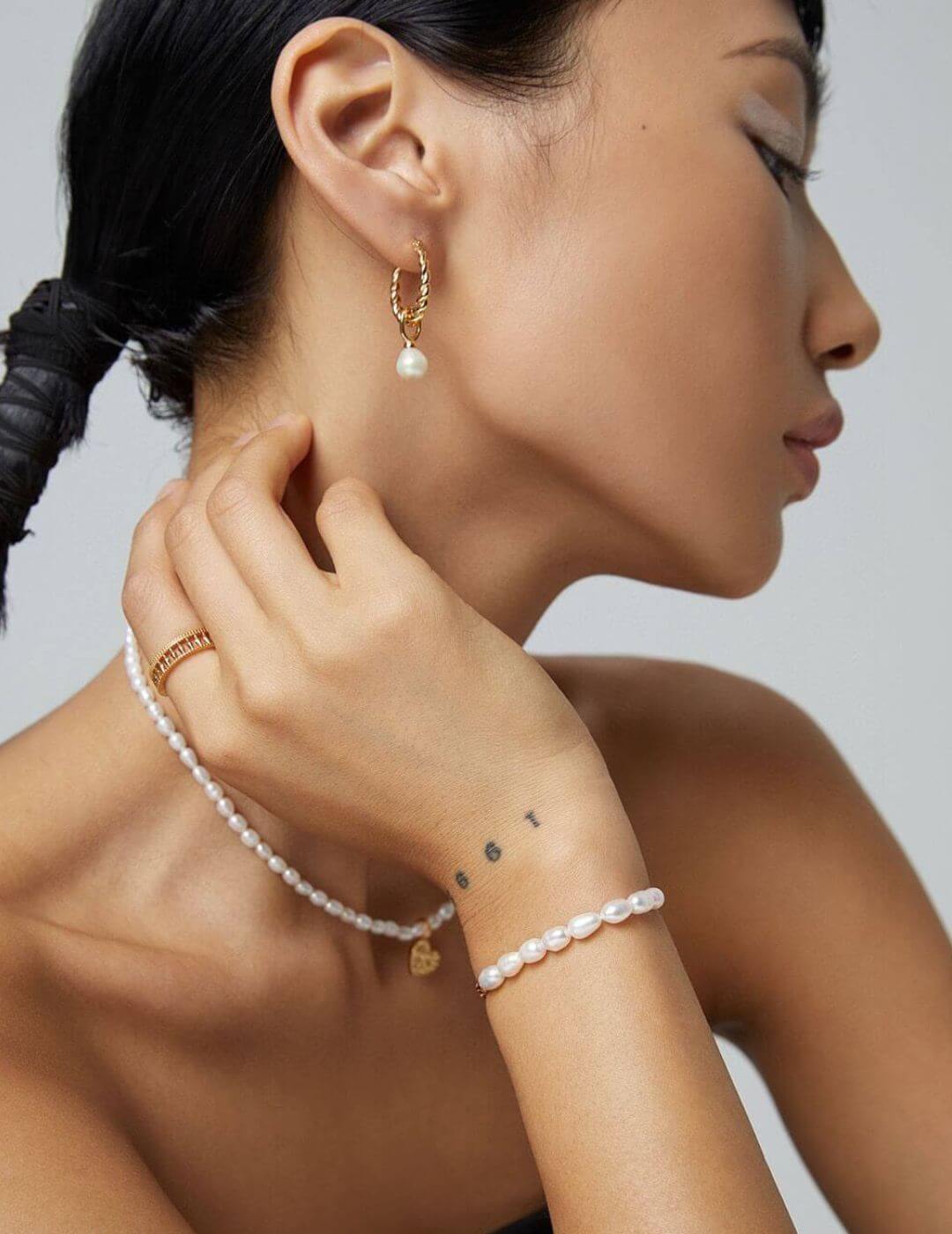 Detail shot highlighting the delicate drop setting and craftsmanship.