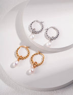 Front view of elegant natural pearl drop earrings in S925 sterling silver.