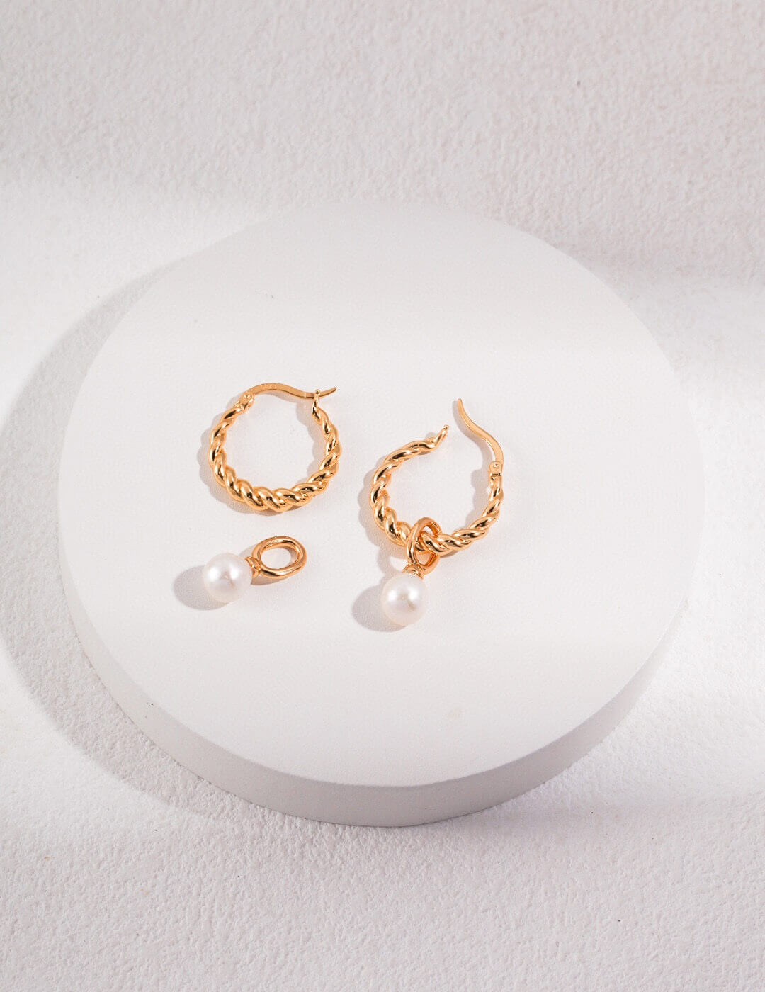 Natural pearl drop earrings in classic silver plating.