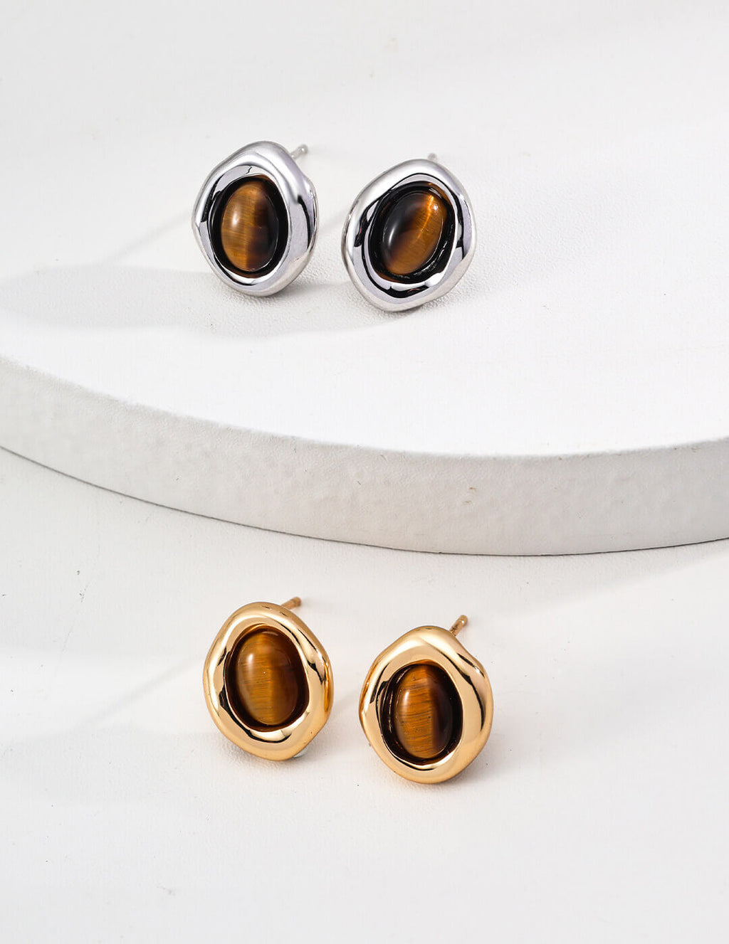 Front view of minimalist natural Tiger's Eye stud earrings in S925 sterling silver.