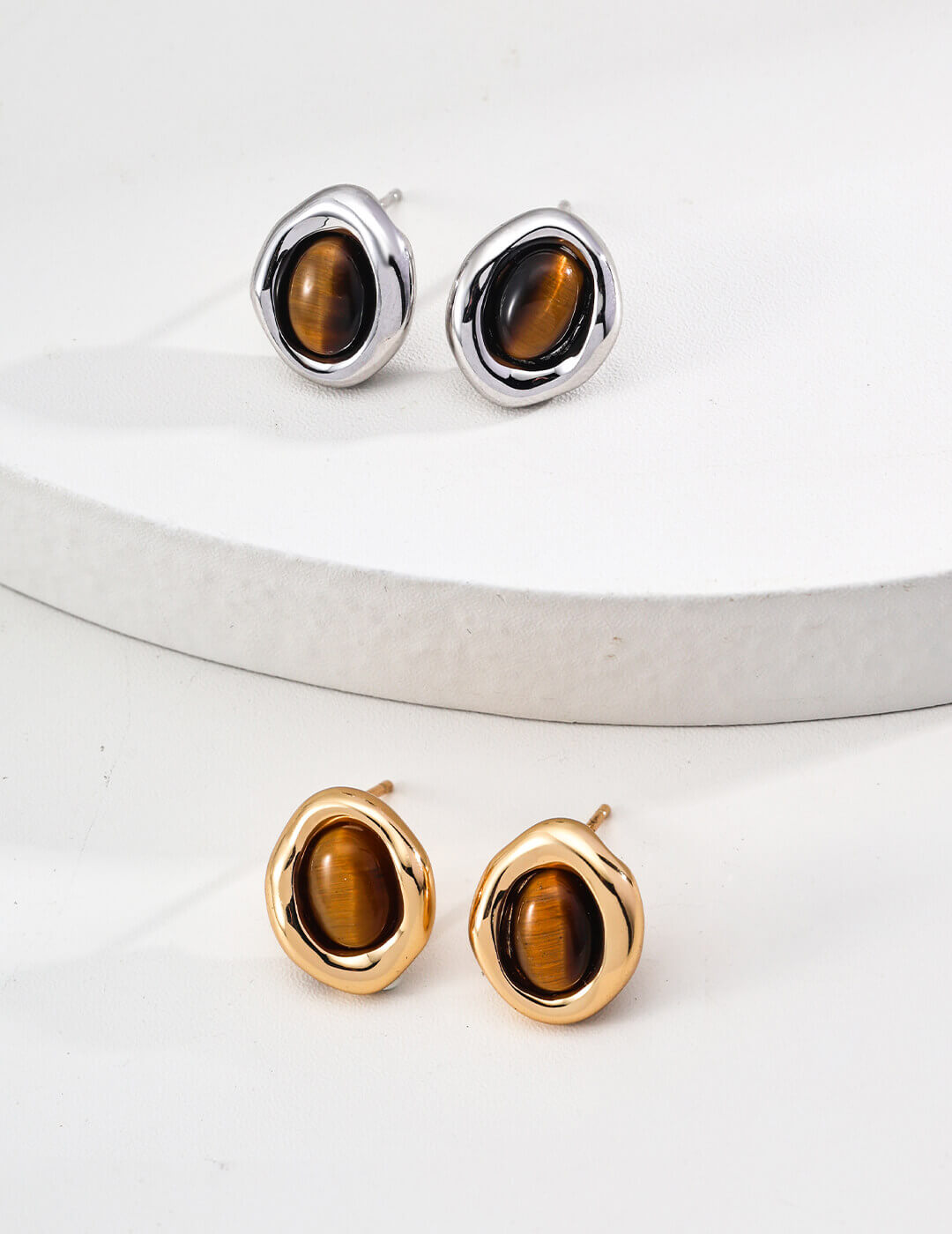 Front view of minimalist natural Tiger's Eye stud earrings in S925 sterling silver.