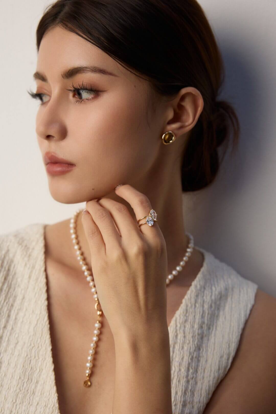 Natural Tiger's Eye earrings adding a touch of elegance to a casual outfit.