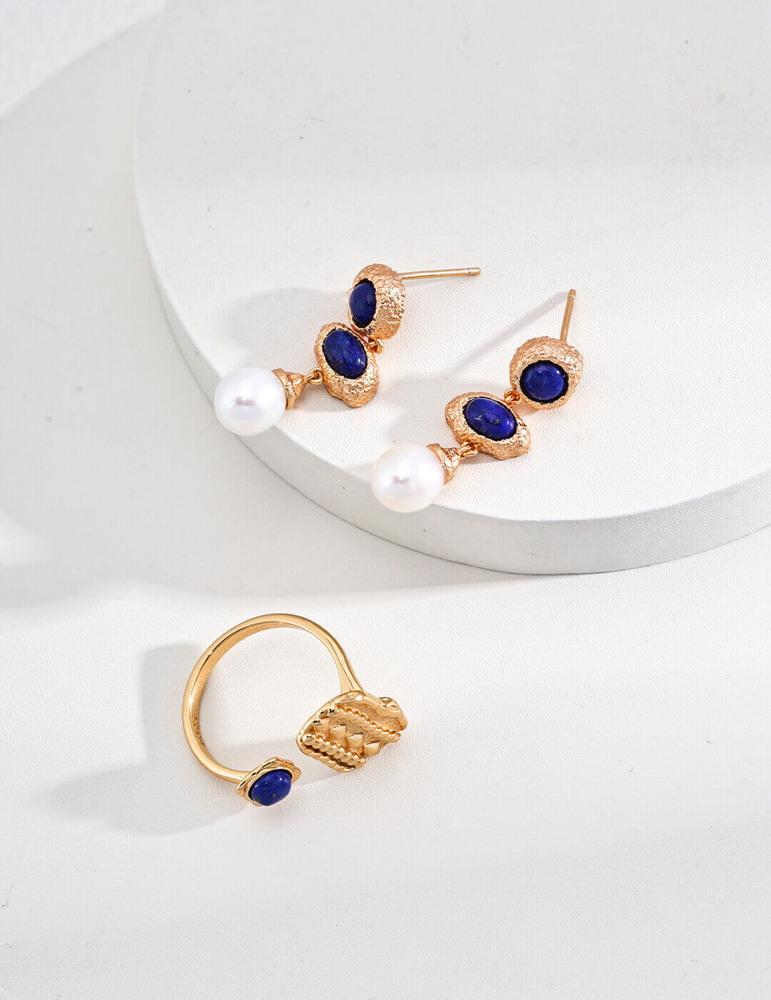 Secure and comfortable sterling silver ear hook design for natural pearl and lapis lazuli drop earrings.