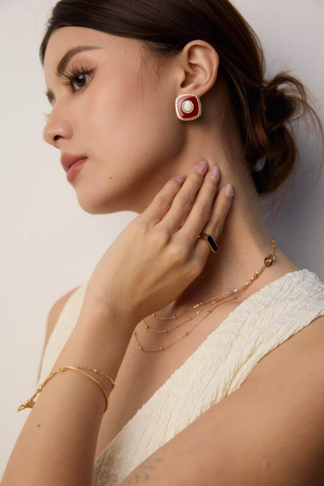 White shell and red enamel earrings presented in an Annealr signature gift box, perfect for gifting.