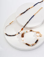 The bracelet stacked with other gold and crystal bracelets for layered look.