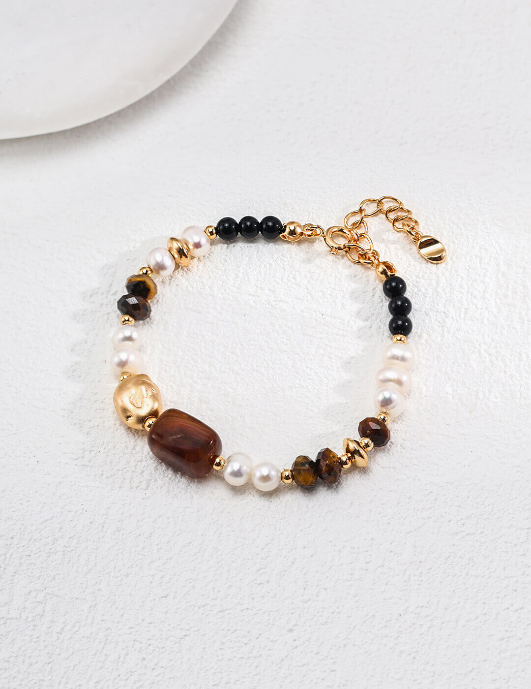 Bracelet with beads on a white surface