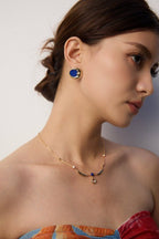 Model portrait showcasing timeless luxury of vintage Lapis Lazuli earrings, perfect for those who appreciate celestial elegance.
