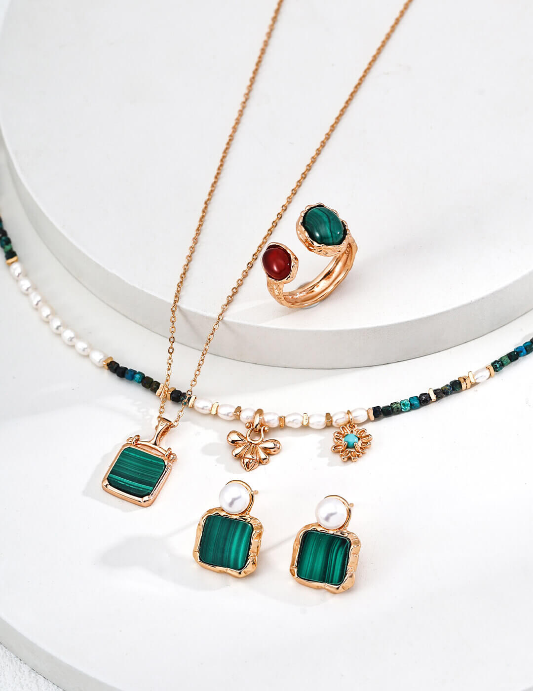 Vintage color malachite necklace in natural sunlight, showcasing green stone's beauty and pristine setting.