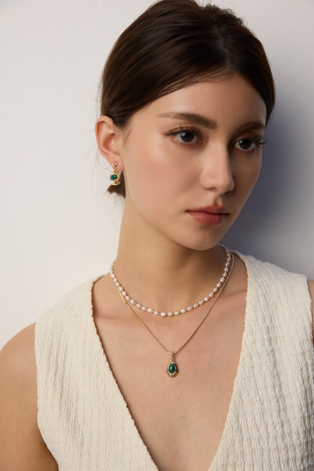 Close-up of the vintage gold lobster clasp and extender chain.