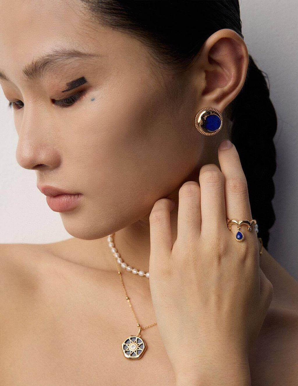 Vintage Lapis Lazuli earrings adding a touch of ancient charm and sophistication to professional business attire.
