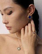 Vintage Lapis Lazuli earrings adding a touch of ancient charm and sophistication to professional business attire.