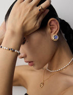 Side view of vintage Lapis Lazuli earrings on model, showcasing the 2cm drop and celestial elegance against skin.


