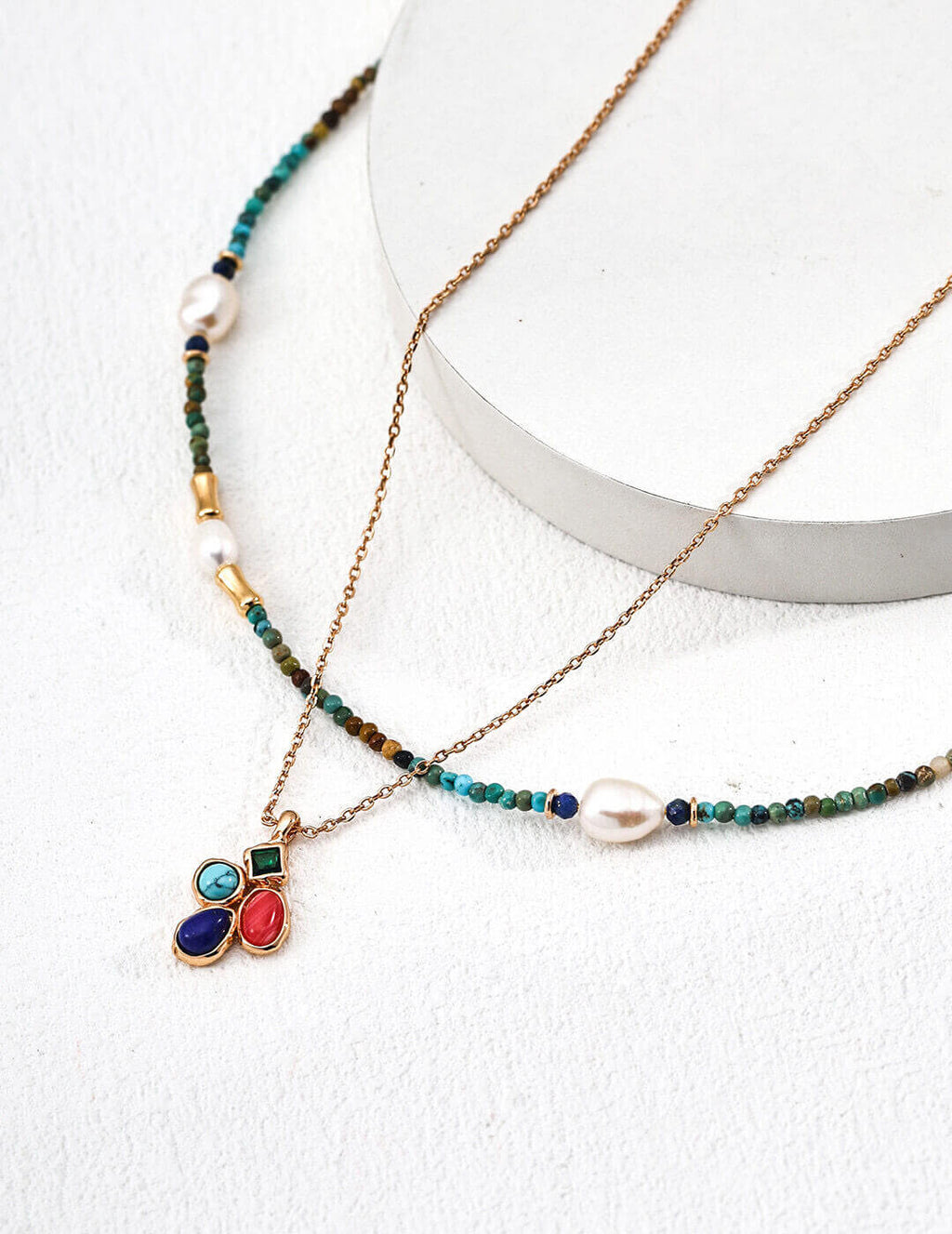 Detailed portrait focusing on the model's face and the necklace as a statement piece.