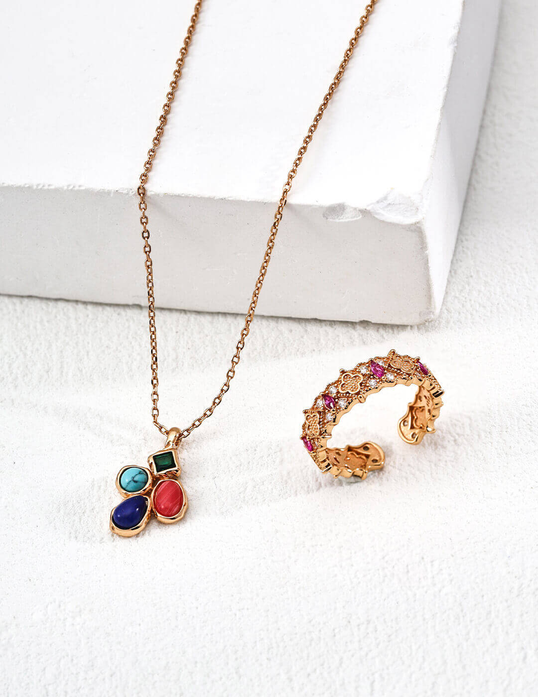 The necklace beautifully draped on a velvet surface to highlight its elegance.