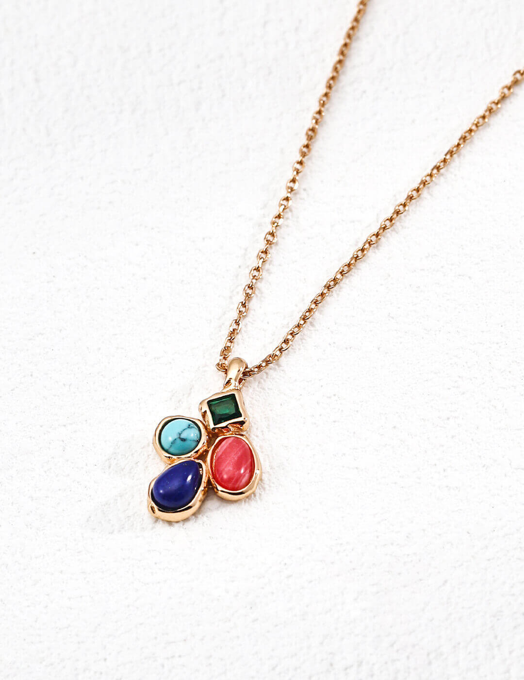 Front view of the vintage multi-gemstone pendant necklace featuring lapis lazuli,