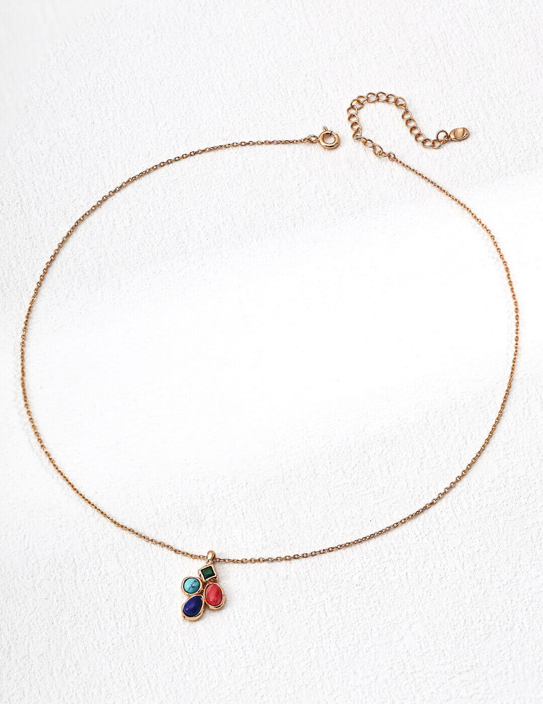 Macro detail highlighting the textures and colors of lapis lazuli, turquoise, and rhodochrosite.