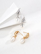 Front view of vintage natural pearl drop earrings in S925 silver