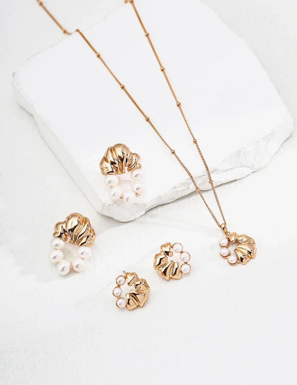Vintage pearl earrings styled with classic jewelry collection.