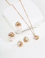 Vintage pearl earrings styled with classic jewelry collection.