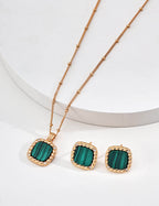 Front view of zircon and malachite stud earrings in vintage gold S925 silver.