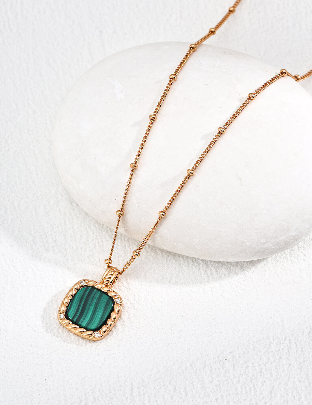Back view showing secure post closure of the malachite and zircon studs.
